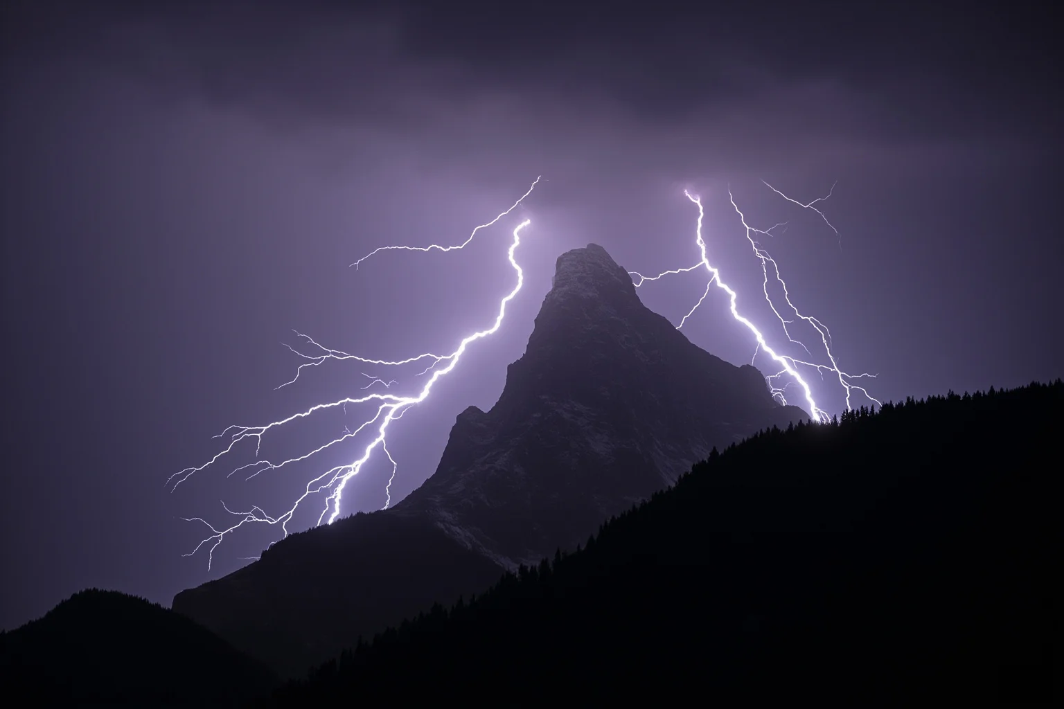 The Human Lightning Rod: The Man Who Was Struck Seven Times 18 Multiple lightning bolts striking a rocky mountain ridge simultaneously, dramatic sky