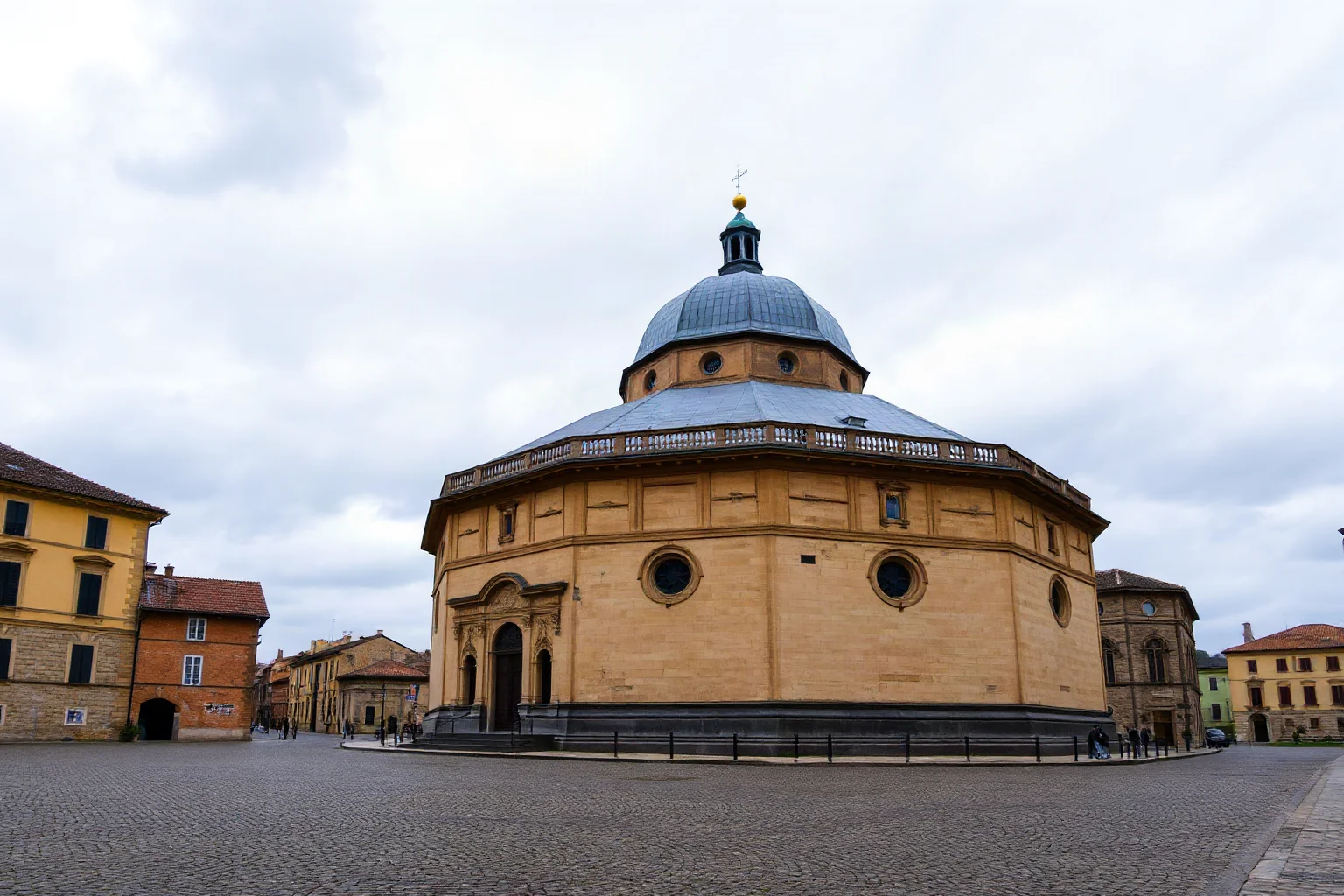 Octagonal medieval cathedral with a domed roof, Carolingian architecture, cobblestone square in front, overcast sky