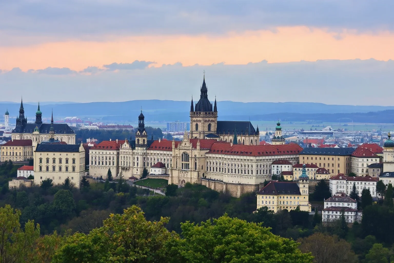 Prague Castle complex stretching across the hilltop with St. Vitus Cathedral and multiple palace structures