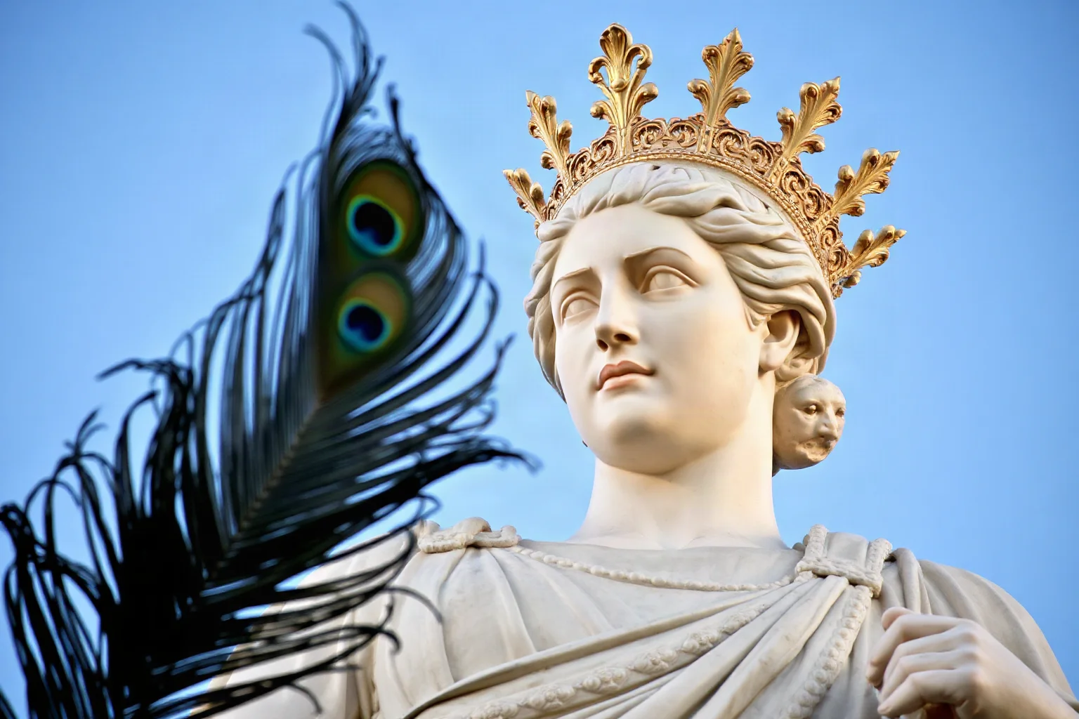 Regal Roman statue of Juno wearing a diadem, peacock feather motif nearby, classical marble art style