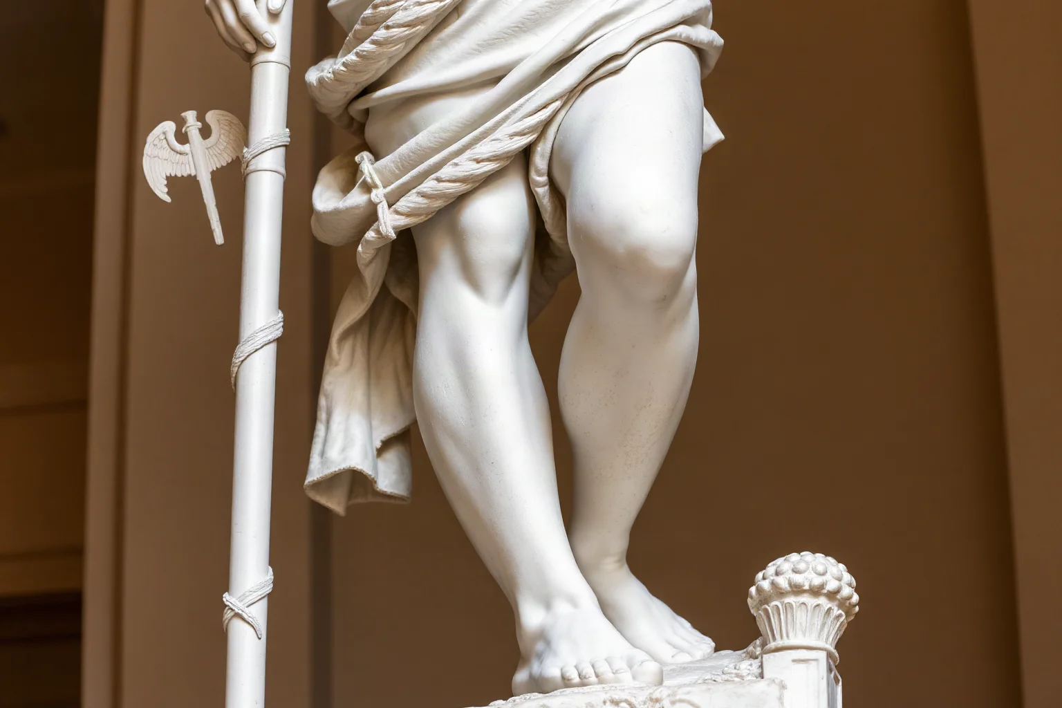Roman statue of Mercury with winged sandals and a caduceus staff, classical sculpture style