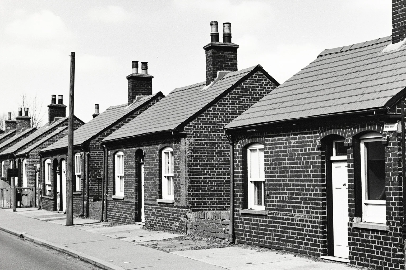 Rows of small brick model cottages representing Victorian working-class housing reform