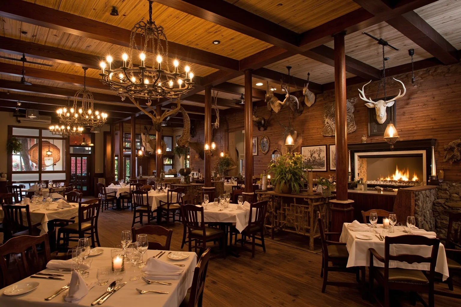 Rustic Western steakhouse dining room decorated with mounted animal heads and frontier memorabilia