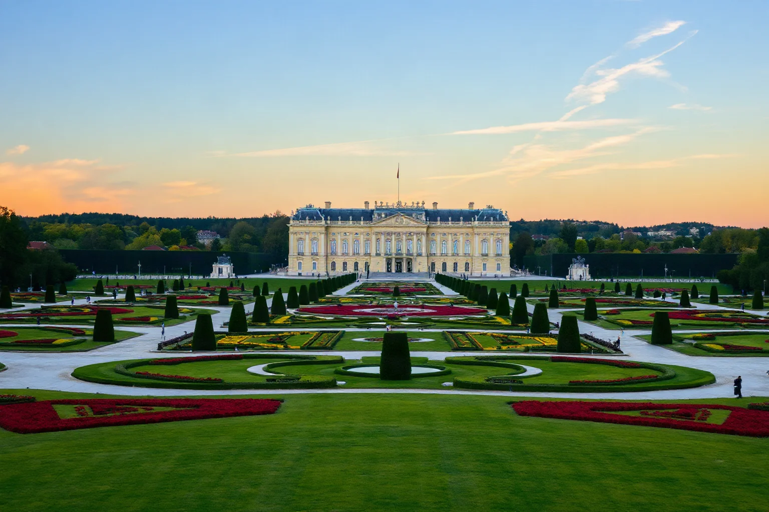 Schönbrunn Palace in Vienna with its Baroque yellow facade and formal gardens stretching into the distance