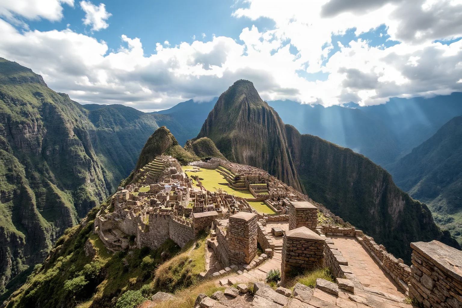 Terraced stone Andean mountain ruins with narrow stone roads winding through the peaks