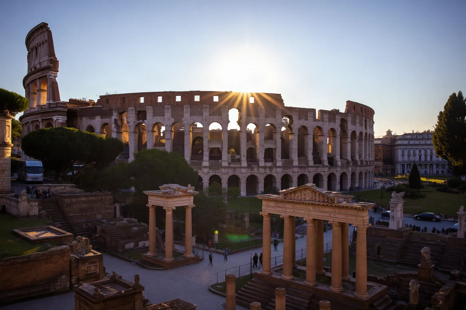 The Roman Colosseum and forum ruins bathed in golden afternoon light