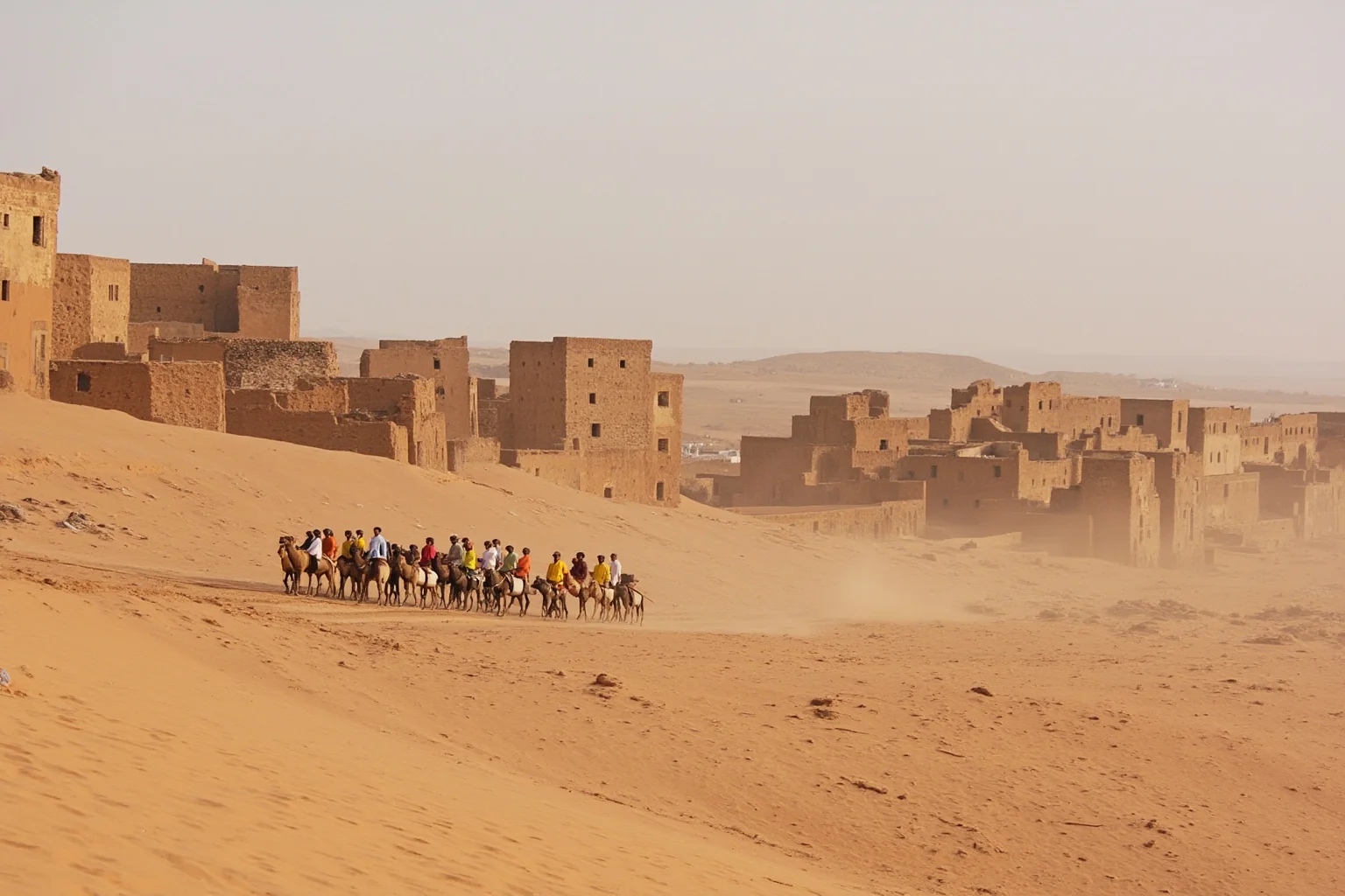 West African trading caravan crossing the Sahara toward the mud-brick city of Timbuktu