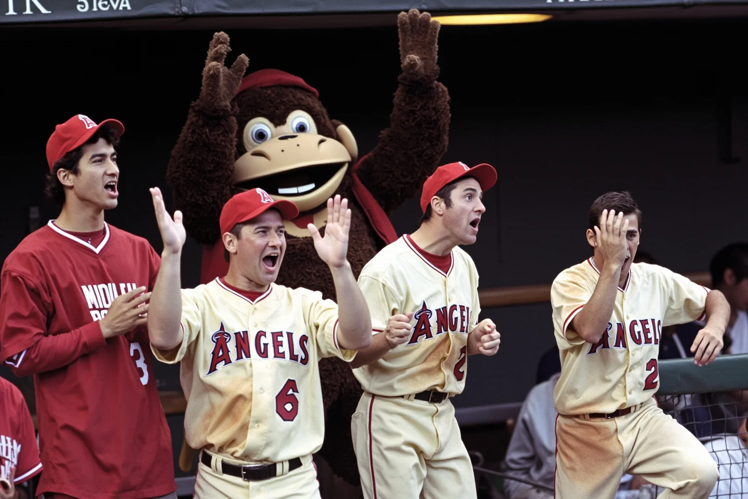 25 Memorable Moments That Defined World Series History 20 A 2002 Angels-style rally in the dugout, players cheering, Rally Monkey mascot in background, no recognizable faces.