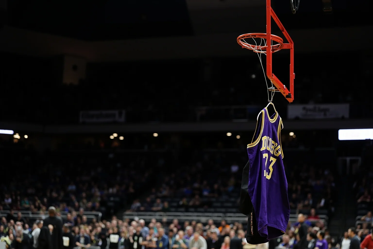 A basketball court with a purple and gold jersey hanging on the hoop, empty arena seats, dramatic lighting, no identifiable figures