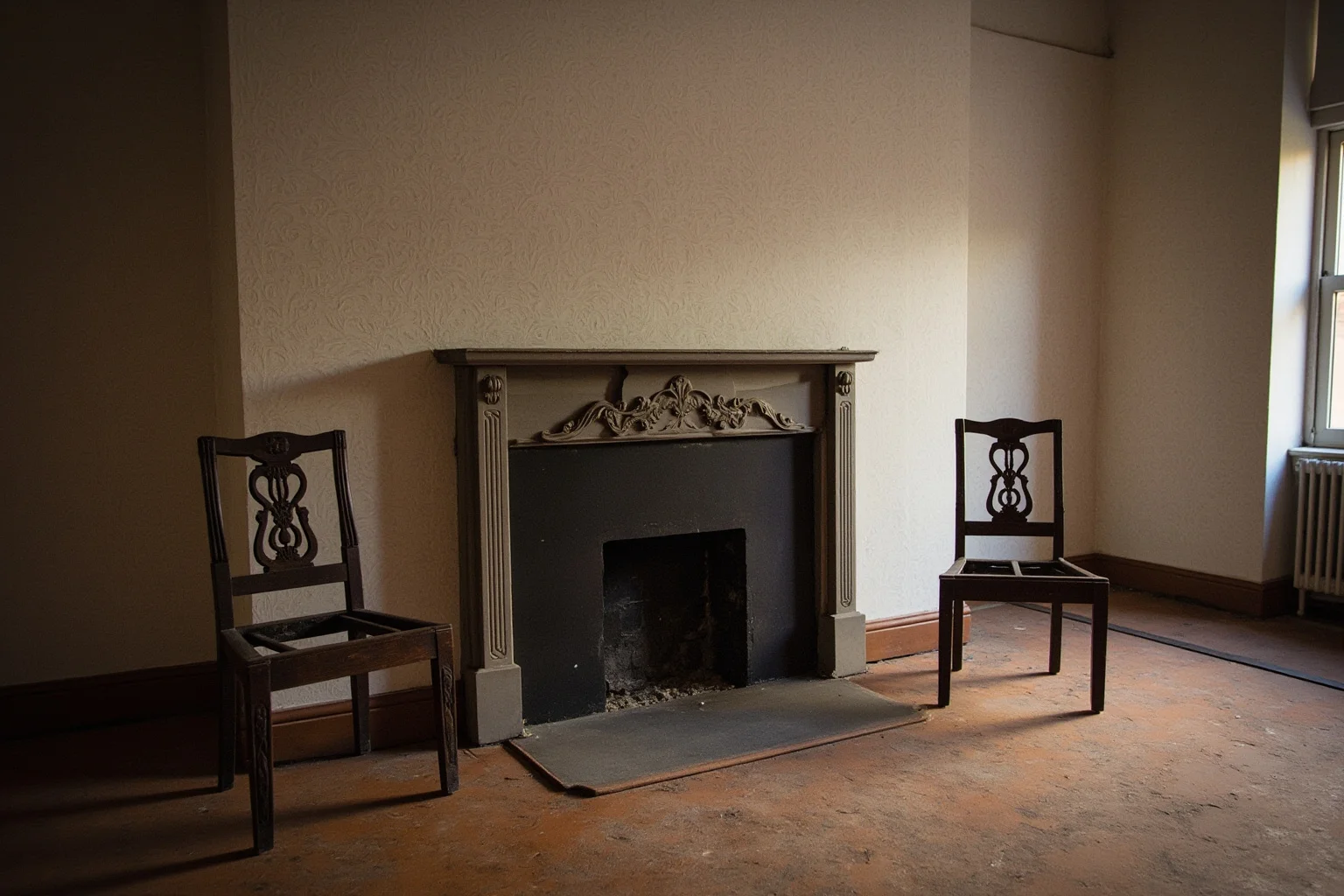 A formal 1850s Washington parlor with two empty chairs beside a fireplace, no people.
