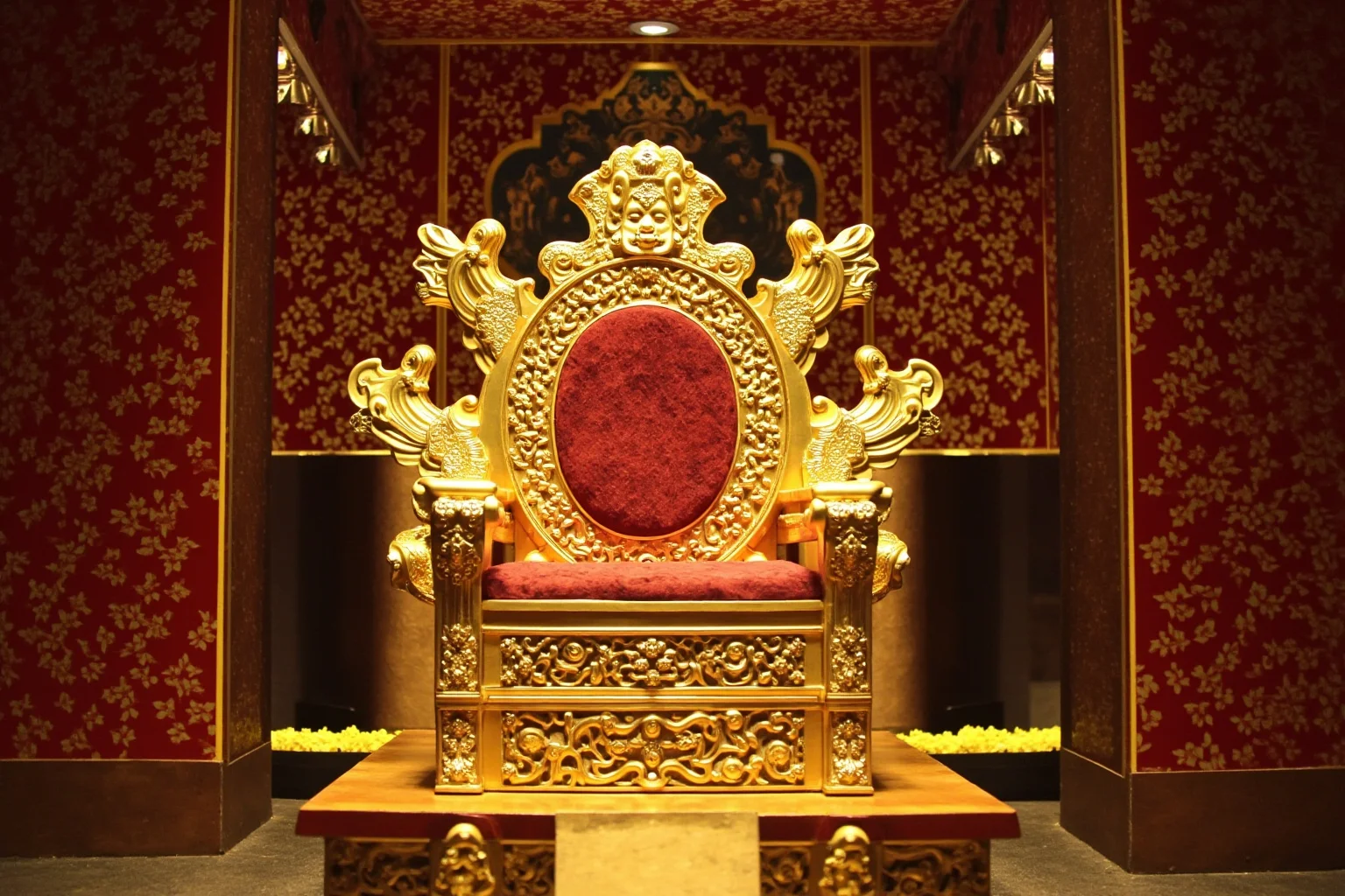 22 Evil Dictators Who Were Eventually Overthrown 13 A golden throne surrounded by diamond-encrusted regalia in a grand cathedral-like hall, no people.