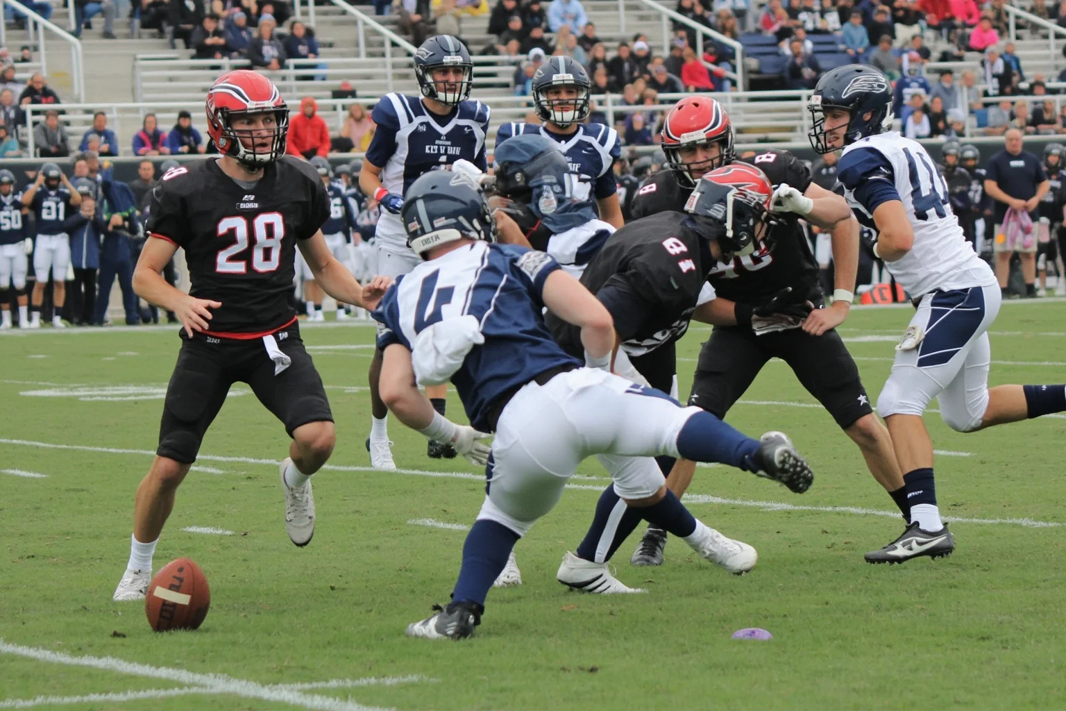 A kickoff return for a touchdown to open the second half, generic uniforms, no real logos or names, blockers ahead.
