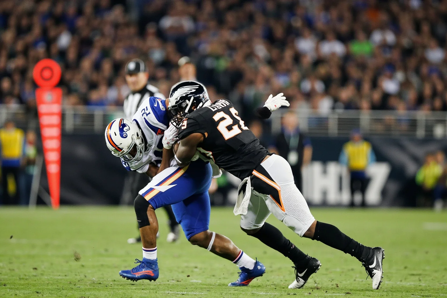 A linebacker tackling a receiver at the 1-yard line as time expires, generic uniforms, no real logos or names, goal-line drama.