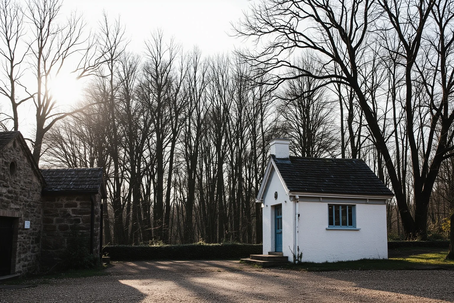 Old Money: 24 Hidden Dynasties That Shaped the Course of History 12 A simple Georgian Quaker meeting house beside a stone bank building, bare trees and a gravel path, grey English morning light, no people, documentary landscape photography.