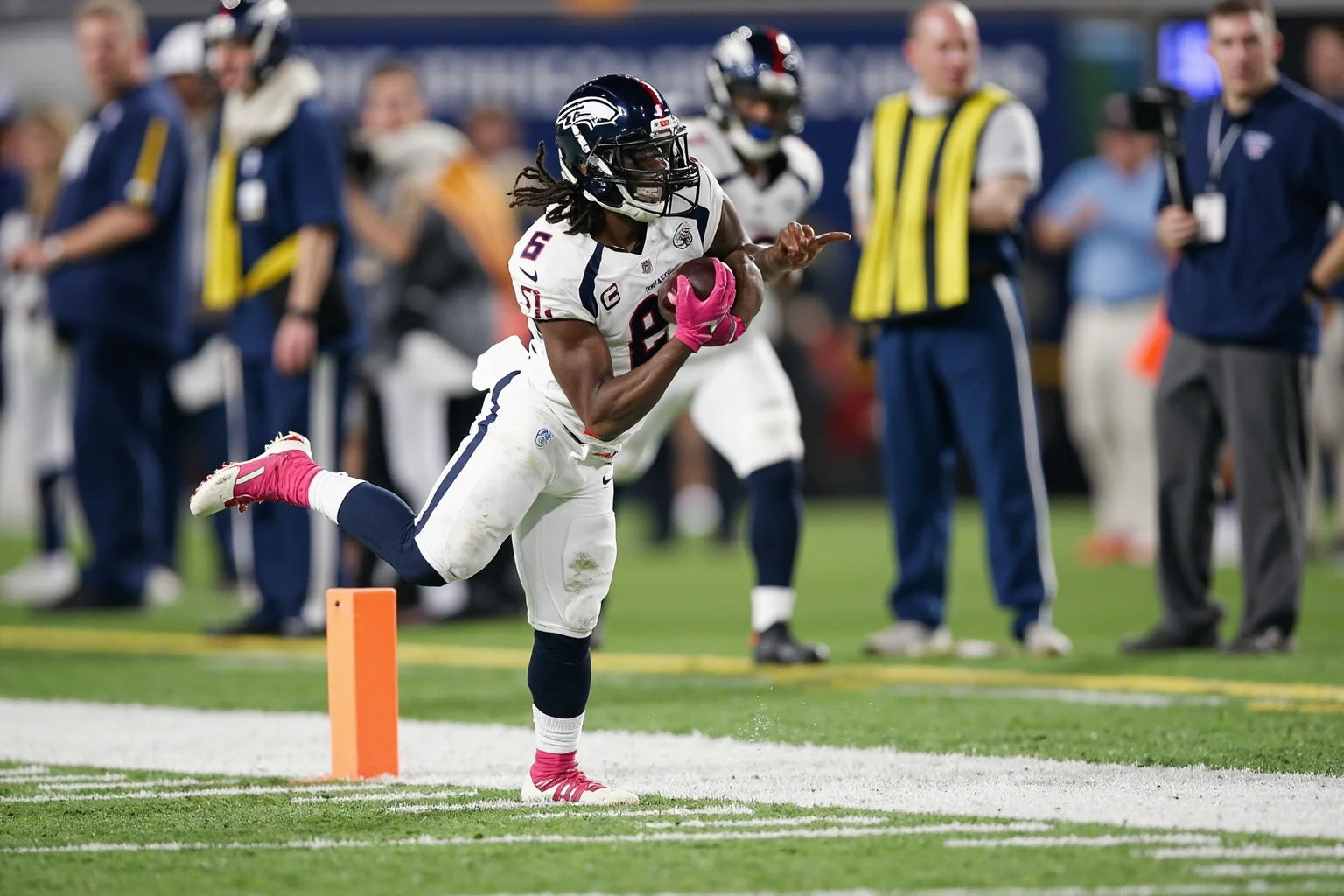 A toe-tap touchdown catch in the back corner of the end zone, generic uniforms, no real logos or names, precise footwork.