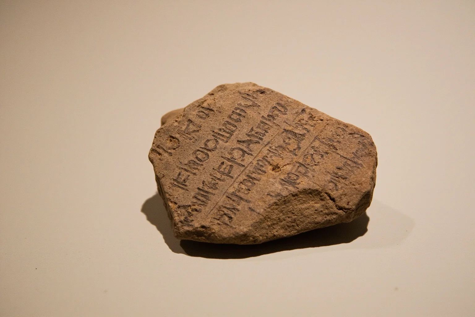 23 Ancient Graffiti Messages That Sound Shockingly Modern 17 Ancient Egyptian limestone ostracon with hieratic writing recording work absences, archaeological photo on a neutral surface, no people.