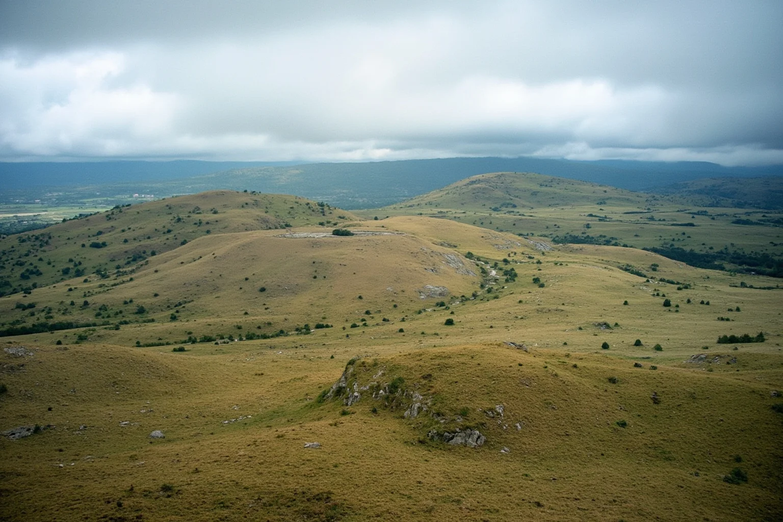 Hills near Visoko, Bosnia, claimed to be ancient pyramids, natural flatiron formations, landscape view, photorealistic