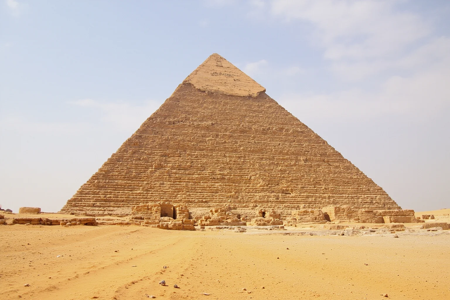 22 Most Famous Pyramids in the World 4 Pyramid of Menkaure with its granite base and smaller queen pyramids nearby on the Giza Plateau.
