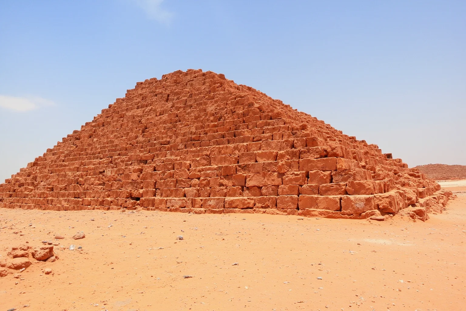 22 Most Famous Pyramids in the World 6 Red Pyramid at Dahshur with reddish limestone blocks and a clear desert sky.