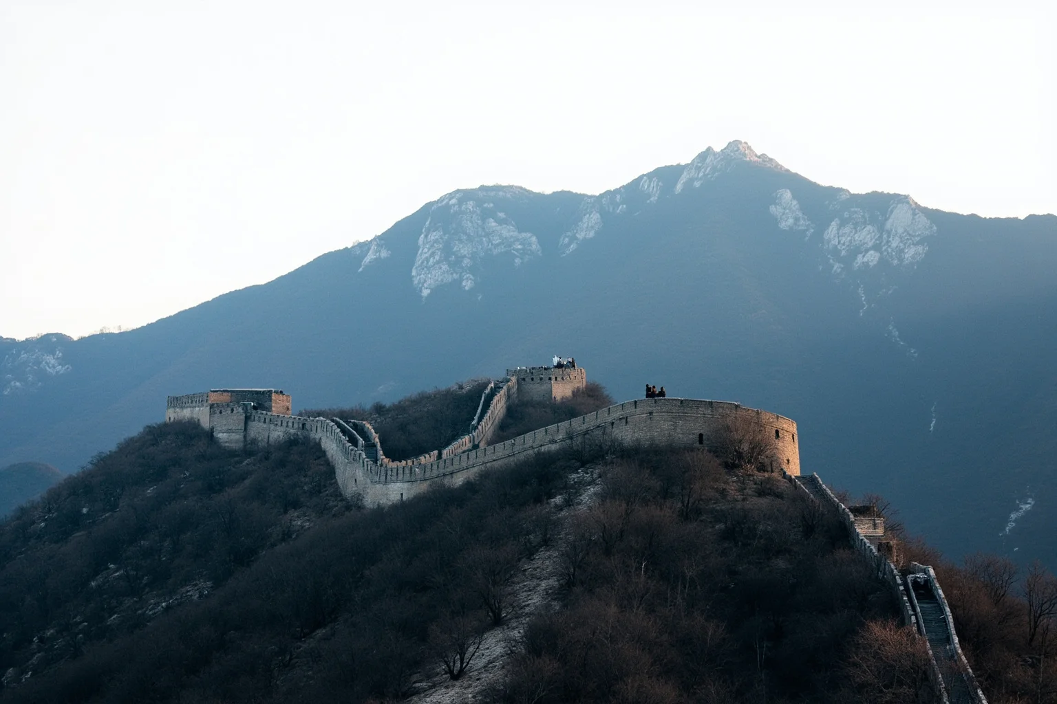 22 Oldest Monuments Found Around the World 22 Section of the Great Wall of China winding through a mountainous landscape, with watchtowers visible along the ridge