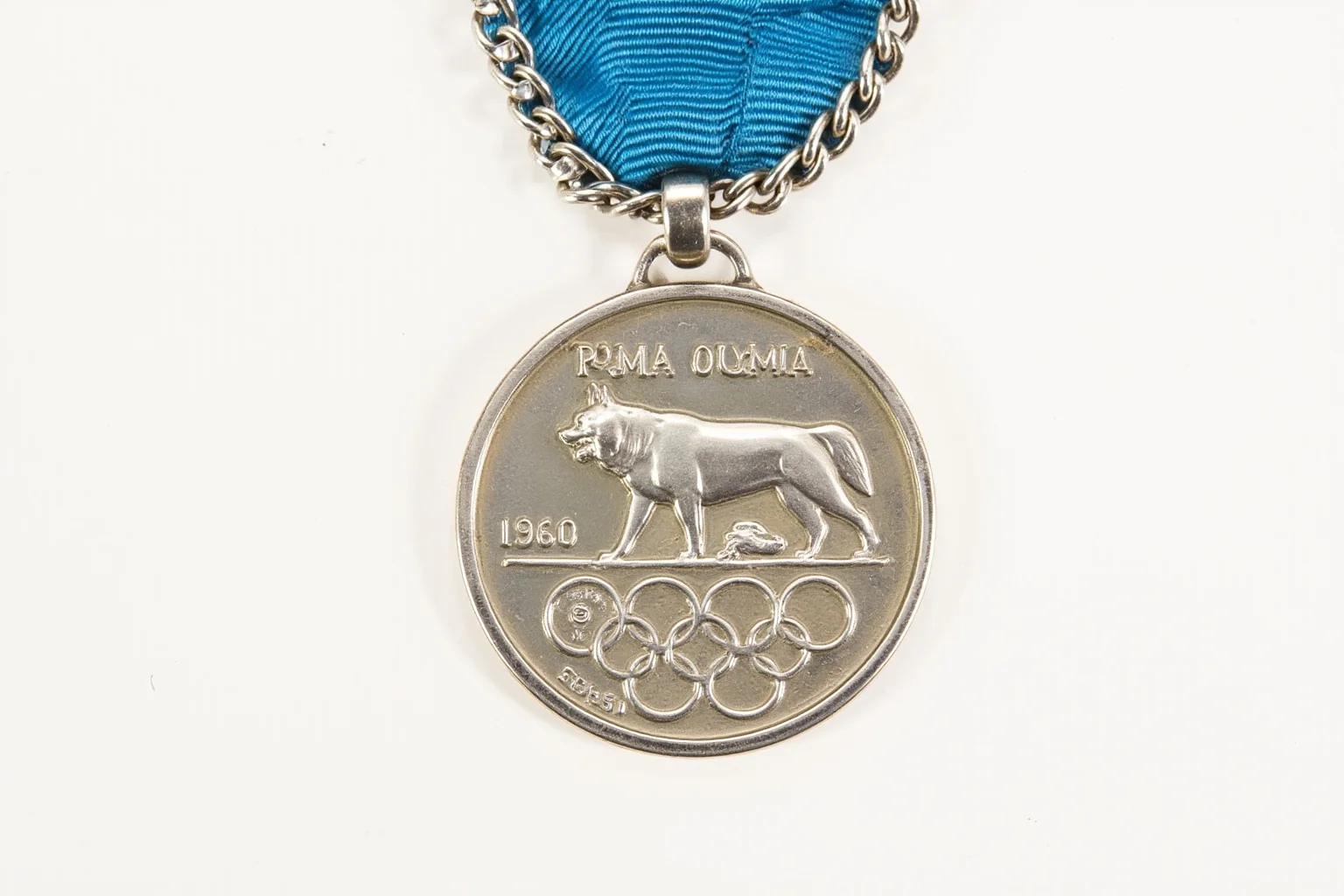 The Weird History of Olympic Medal Designs 7 The 1960 Rome Olympic medal with a chain and a she-wolf motif.