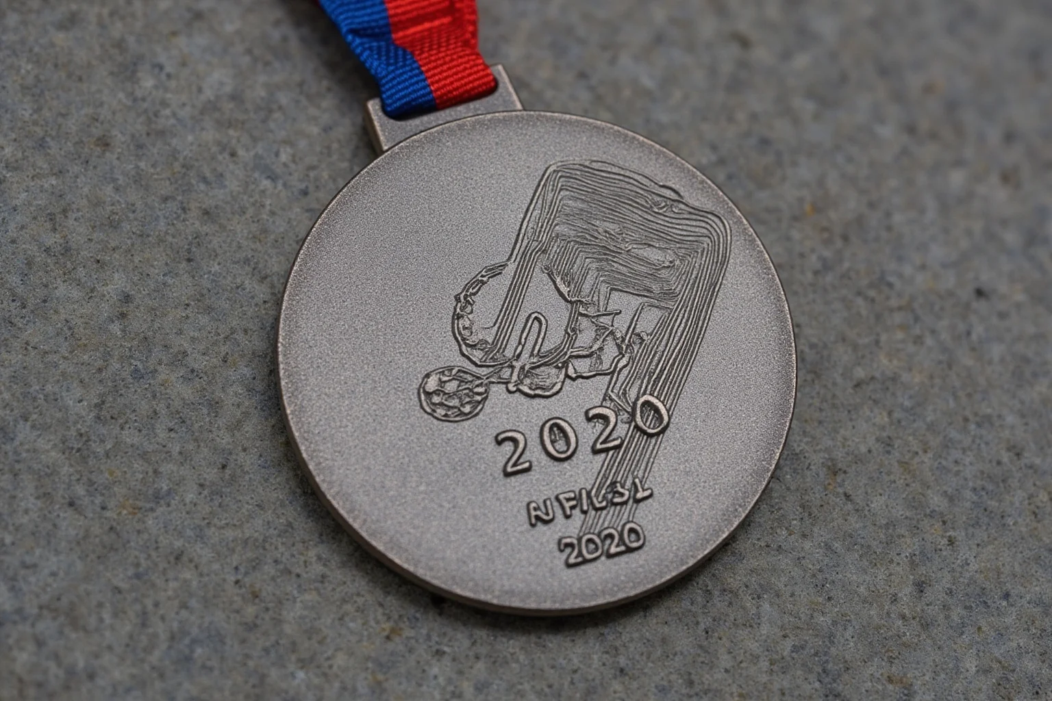 The Weird History of Olympic Medal Designs 16 The 2020 Tokyo Olympic medal made from recycled electronics, with a rough stone texture.