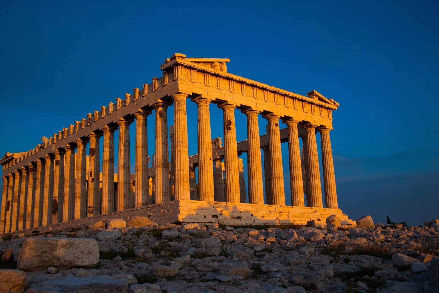 The Parthenon on the Acropolis of Athens at golden hour, marble columns against a deep blue sky