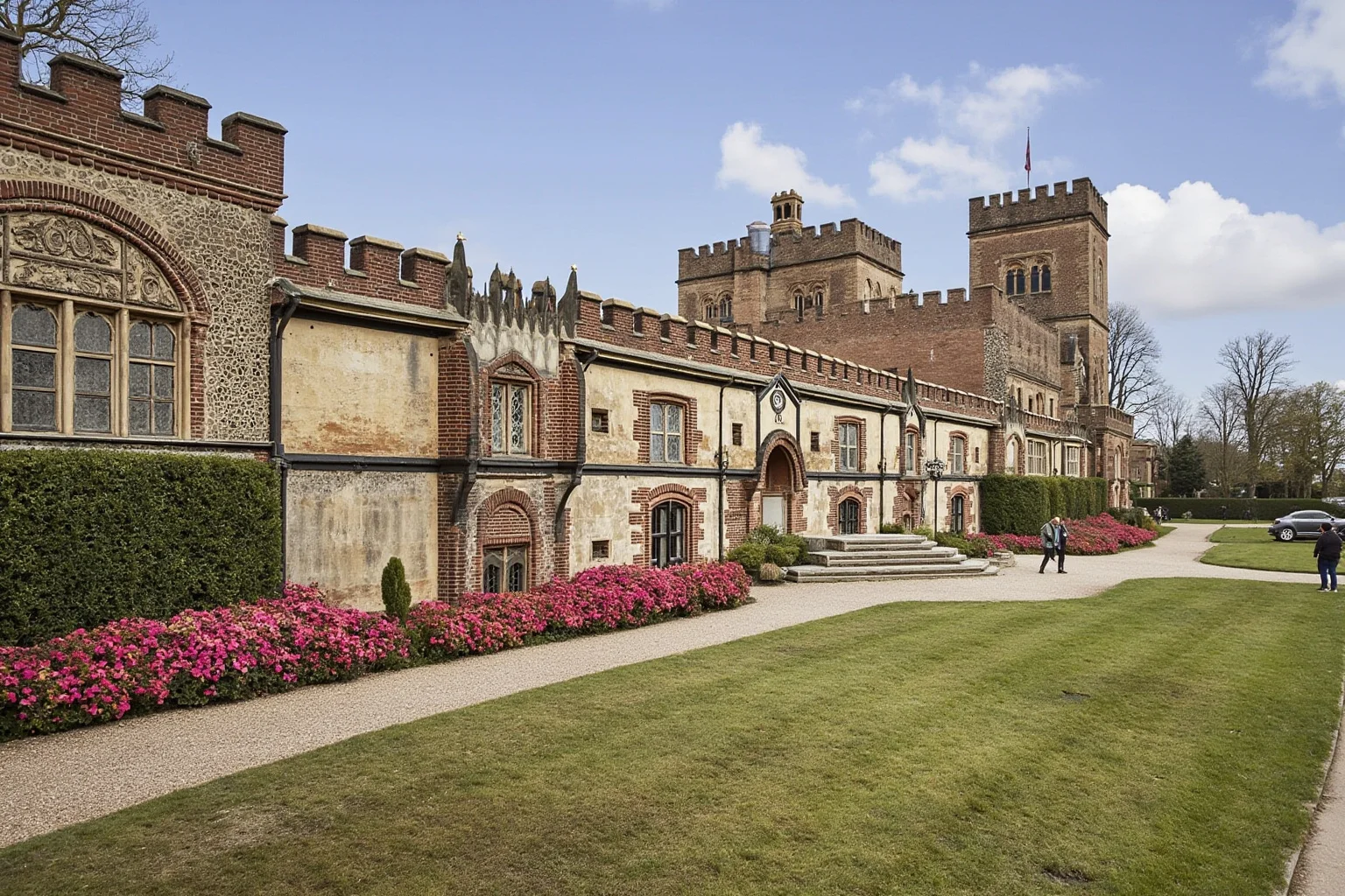 Tudor-era Hampton Court Palace with Tudor rose emblem and Renaissance-era English countryside