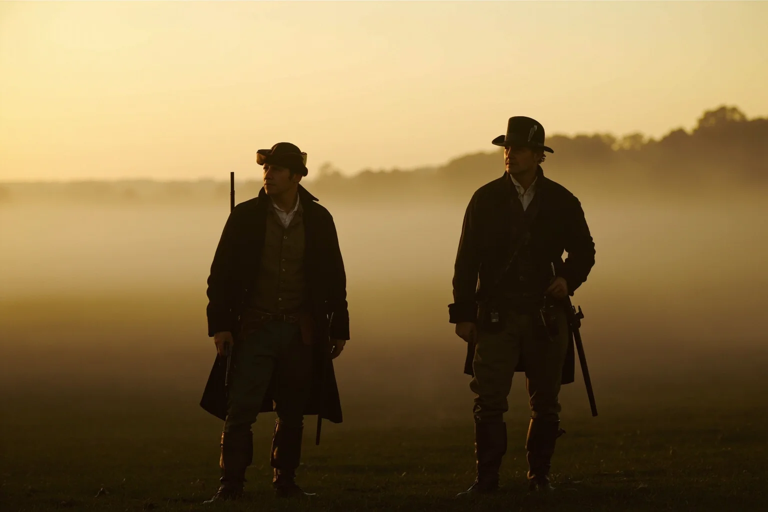 Two 18th-century gentlemen standing beside their seconds in a misty field at dawn, pistols at their sides, period clothing.